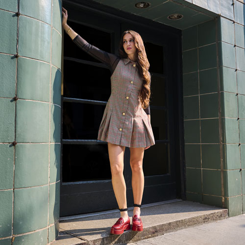 A woman wearing the Kork-Ease Parson platform loafer in Dark Red. Shop Parson.